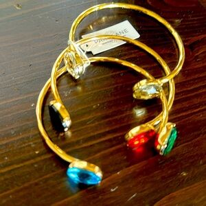 Gold and colorful jewels bracelet set.